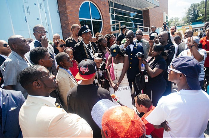 Wikipedia photo. Protesters gather outside the Ferguson Police Department