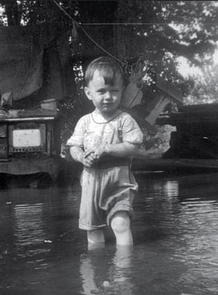 Matthew at the beach . . . actually his front yard during spring flooding of the Mississippi River in 1946 © Mathew Van Tassell